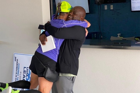 Kevin Sims celebrates a sectional championship win with one of the players he coaches