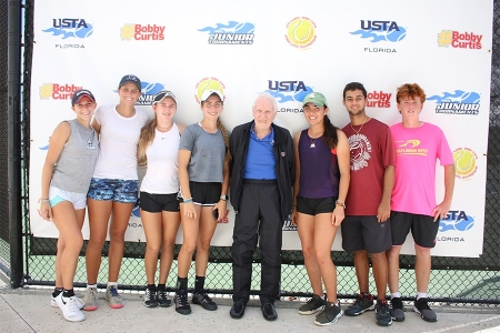 Bobby poses with players at the 2019 USTA Florida Bobby Curtis Junior 16s/18s Sectionals Doubles Championships