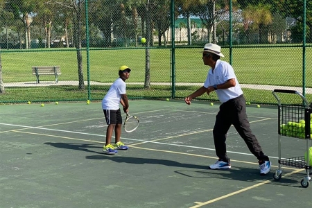 Luis throws a ball to a player