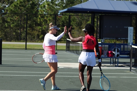 Players high five on the court