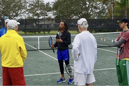 Sherry Price instructing others on the court