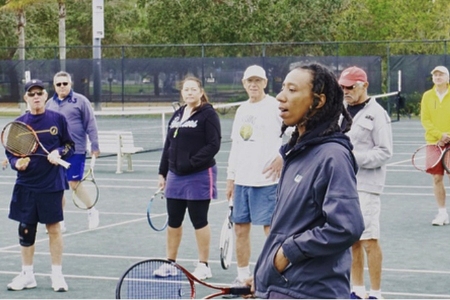 Sherry Price instructing others on the court