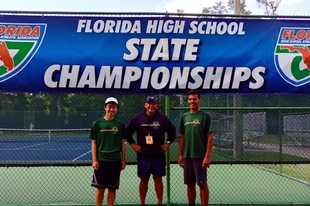Manuel Rosales at the Florida High School State Championships with two of his students