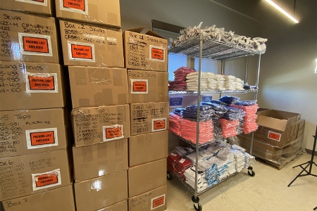 Boxes of EleVen by Venus Clothing being organized by the USTA Florida Foundation, March 2021