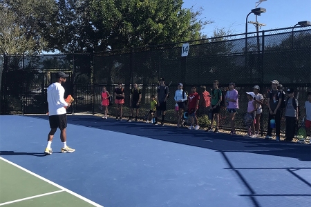 Artie Yentumi on the court with students