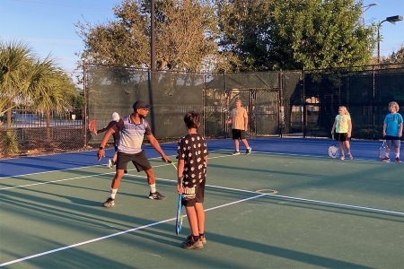 Artie Yentumi on the court with students
