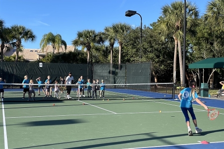 Artie Yentumi on the court with students