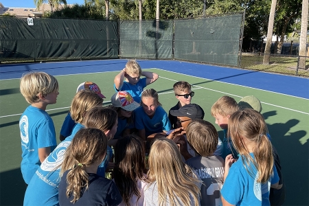 Artie Yentumi on the court with students