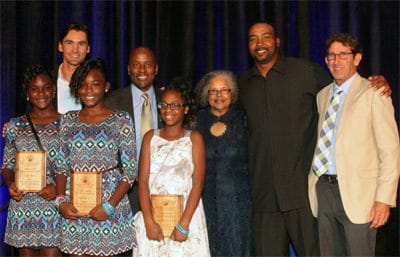 MaliVai Washington (back second from left) with guests and student members of the Compassion Club