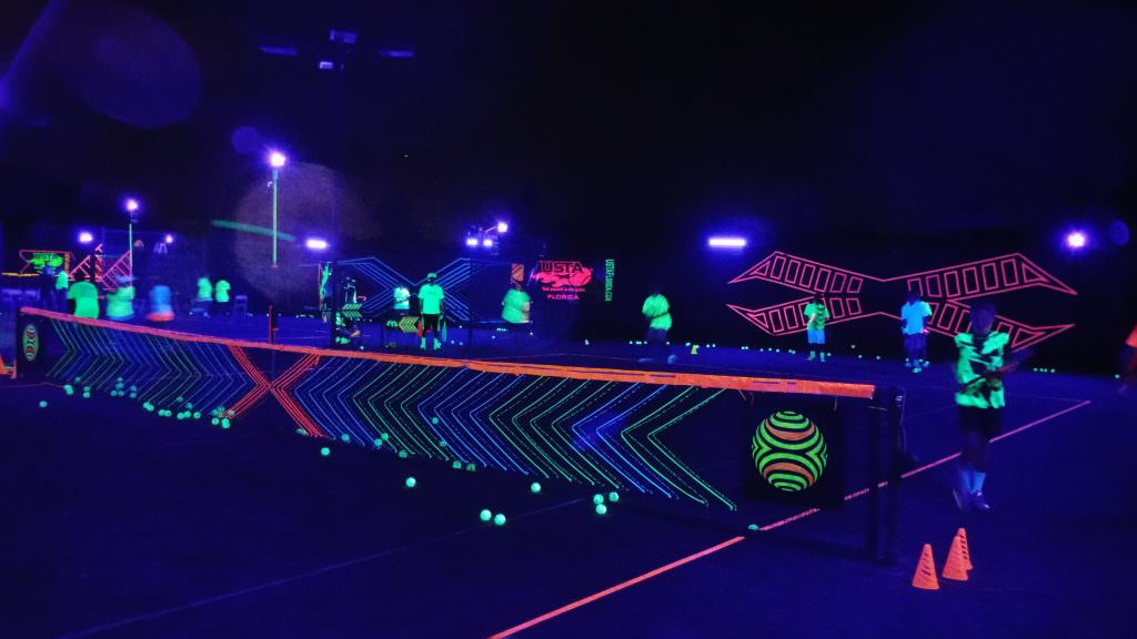 BLACK LIGHTS IN THE BIG CITY: Miami tennis never looked like this before.