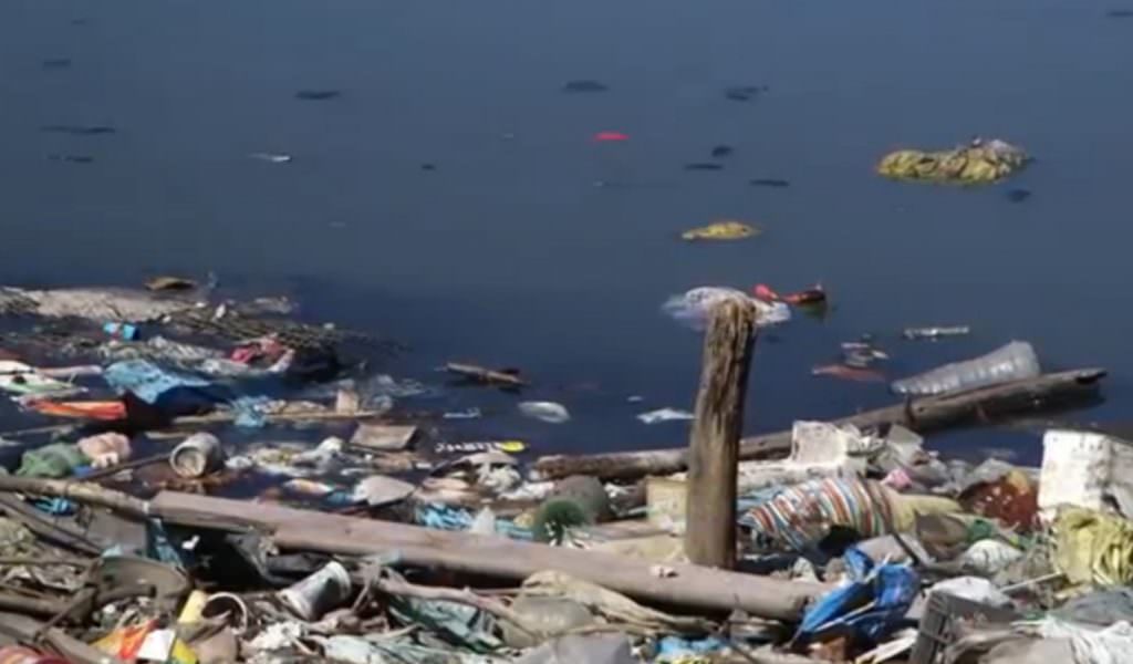 Rio's Guanabara Bay, a dumping ground for trash and excrement from local housing, will host the Olympic sailing events