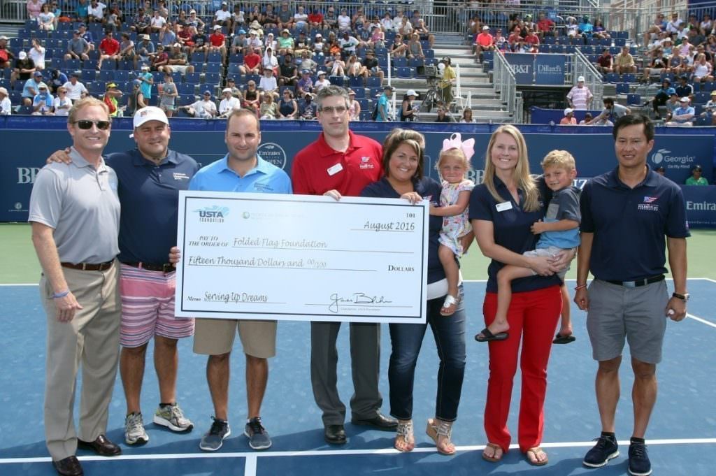 USTA Foundation President Dan Faber (L) meets John Coogan (C), Executive Director of The Folded Flag Foundation, and Peter Brual (R), Folded Flag Foundation Trustee, to present the $15,000 donation