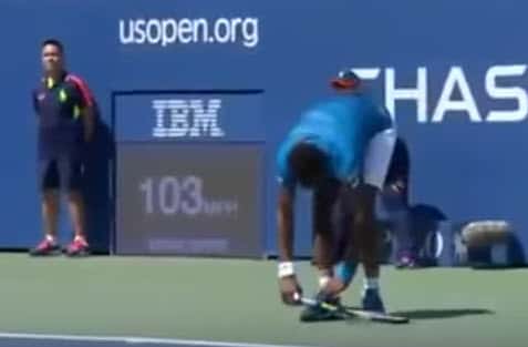 A ball boy watches as Gael Monfils pretends to tie his shoe in the middle of a point to distract his opponent from putting away as easy shot