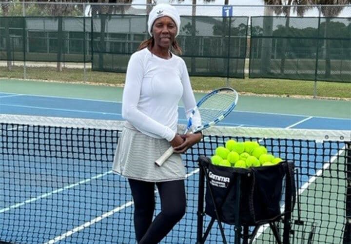 Sibo Kangwa stands on the tennis court