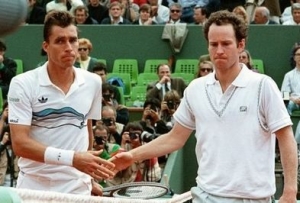 Ivan Lendl (left) and John McEnroe warmly embrace at the net